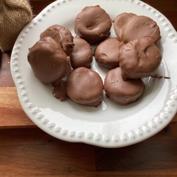 A white plate of rich and creamy peanut butter cups