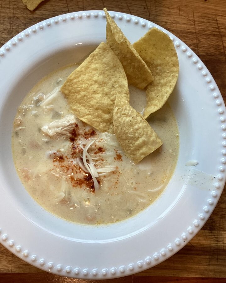 A white bowl of creamy white chicken chili